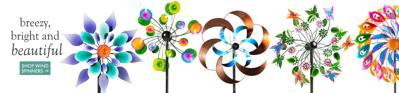 An assortment of brightly colored wind spinners on a white background. Breezy bright and beautiful. Shop Wind Spinners.