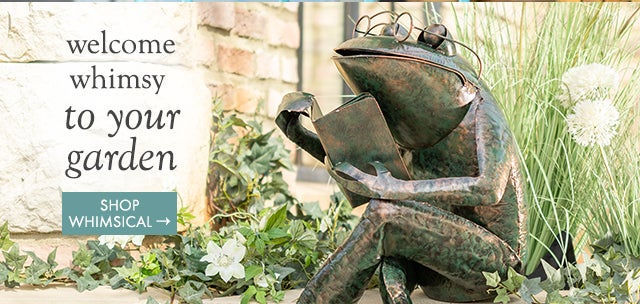 Image of Reading Frog Metal Yard Sculpture in garden. welcome whimsy to your garden. SHOP WHIMSICAL