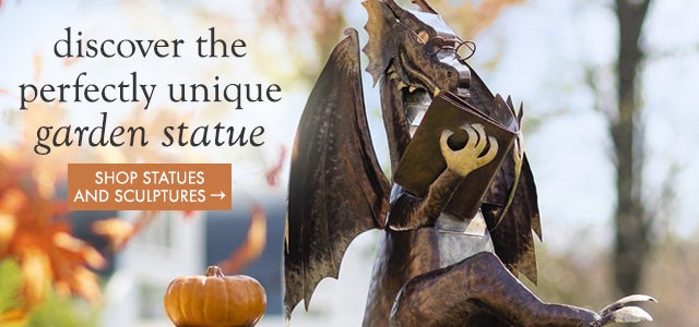 Closeup Image Reading Dragon with Pumpkin. Discover the perfectly unique garden statue. SHOP STATUES AND SCULPTURES
