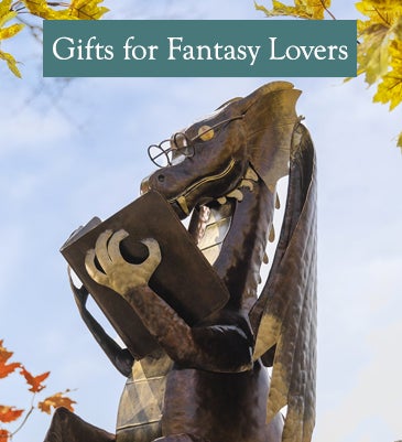 A metal statue of a reading dragon. Shop Gifts for Fantasy Lovers