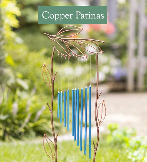 Image of Metal Leaf Trellis with Blue Wind Chime. Copper Patinas