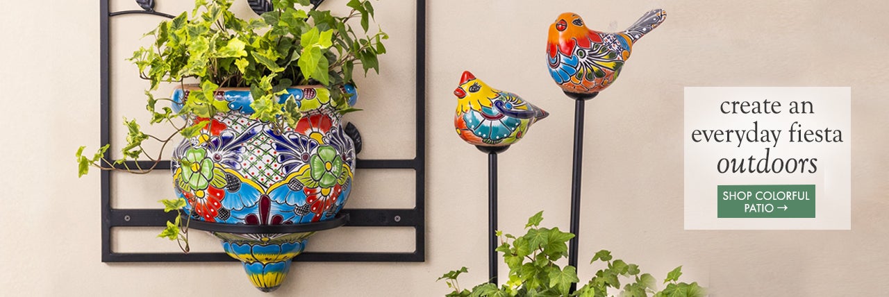 Alt Desktop: image of Handcrafted Talavera-Style Terra Cotta Flat-Backed Wall Planter on wall with Handcrafted Talavera-Style Ceramic Bird Decorative Garden Stake in planter. create an everyday fiesta outdoors  SHOP COLORFUL PATIO