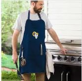 Image of a dad wearing an NFL grilling apron beside a grill.